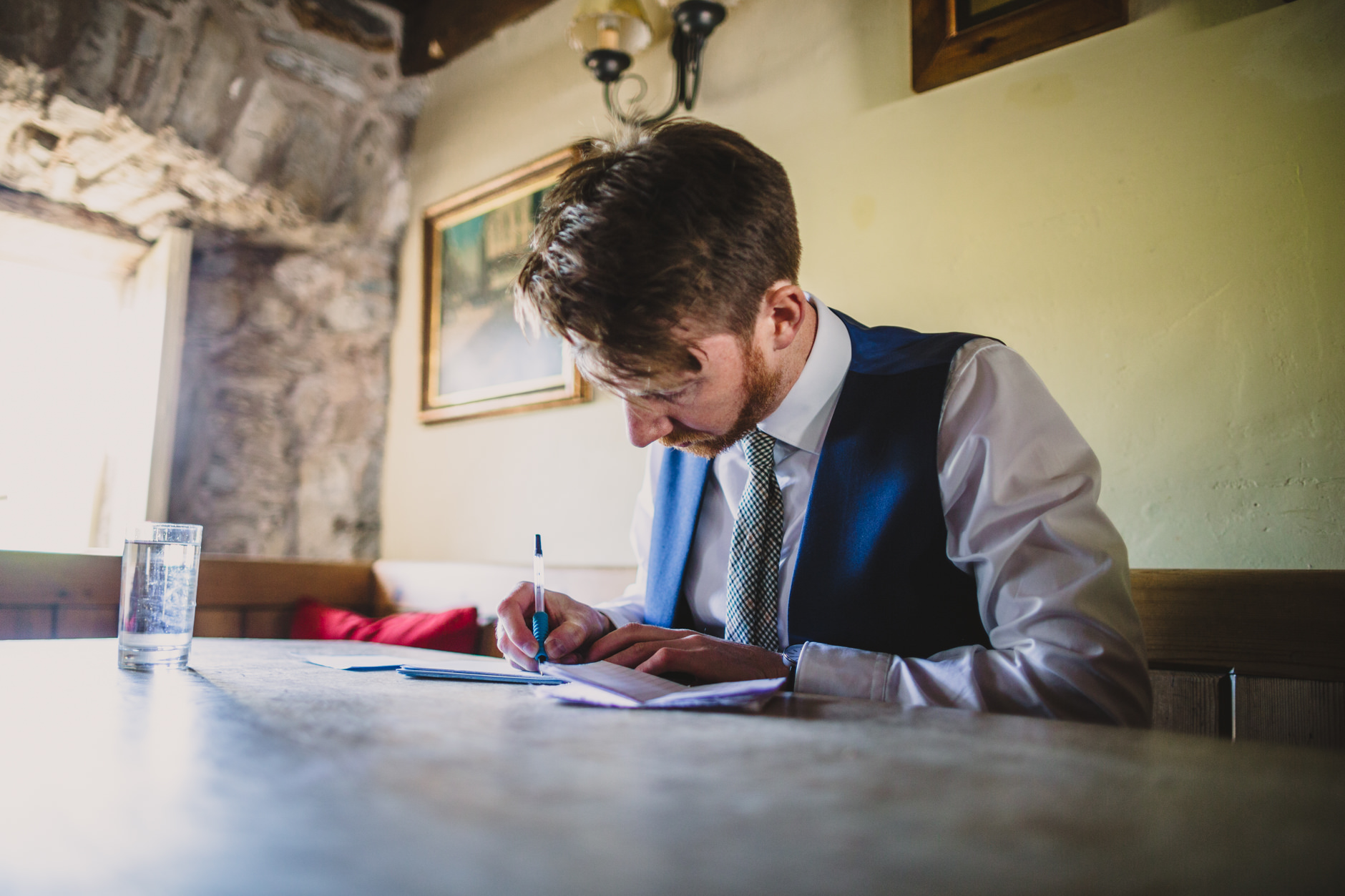 nervous groom writing his speech at knipe hall