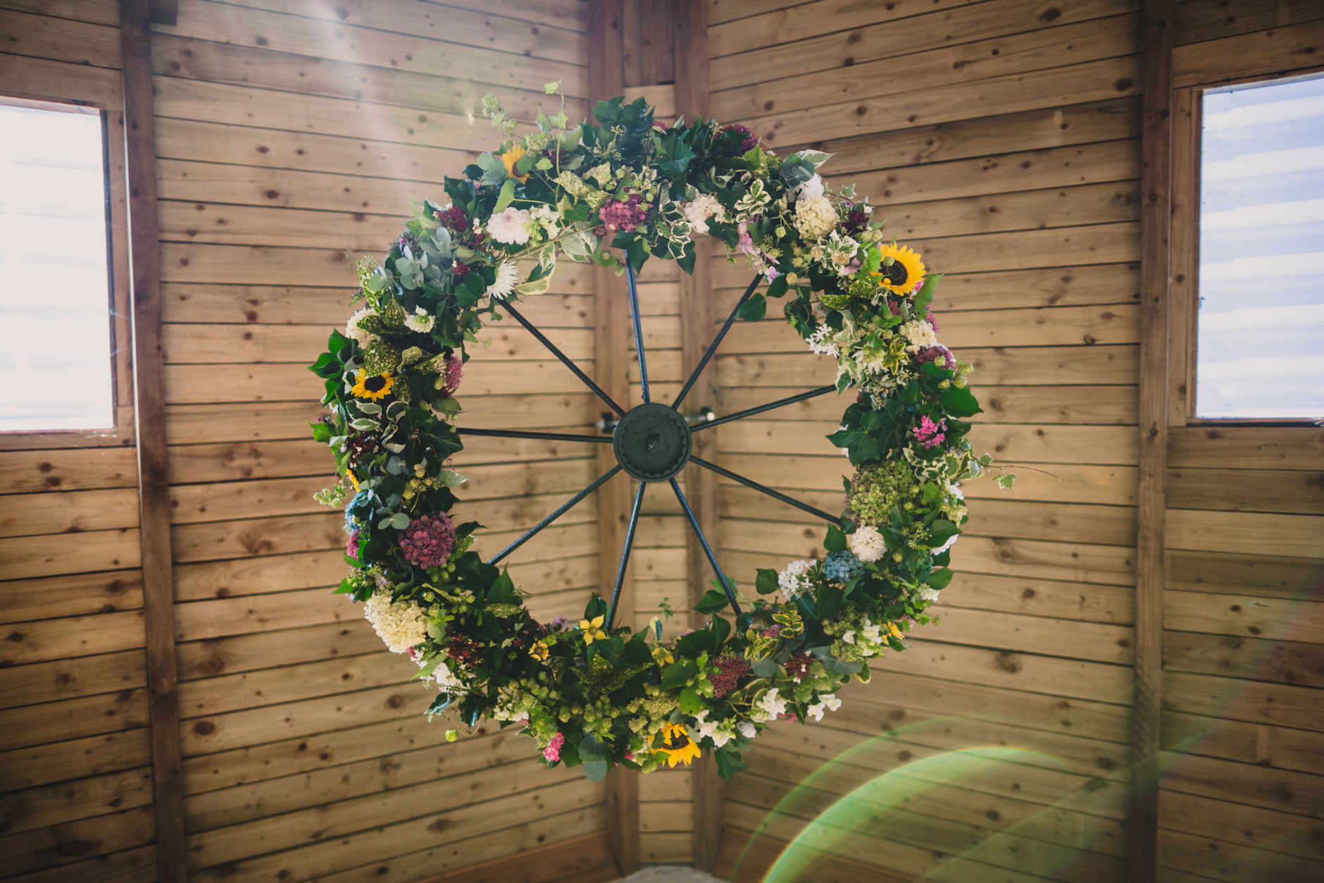 cartwheel floral display for DIY knipe hall wedding