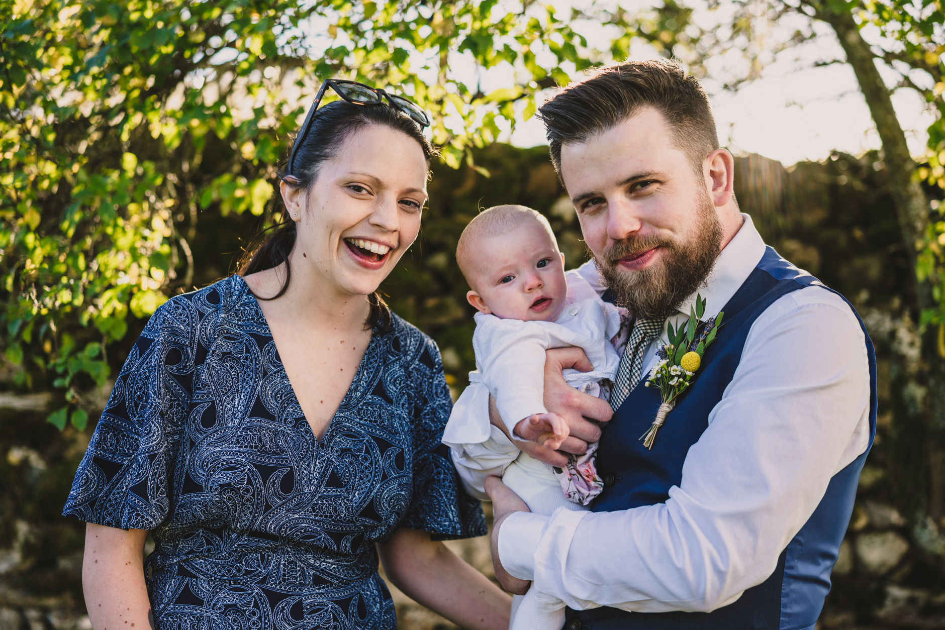 groomsman with his partner and baby at knipe hall wedding