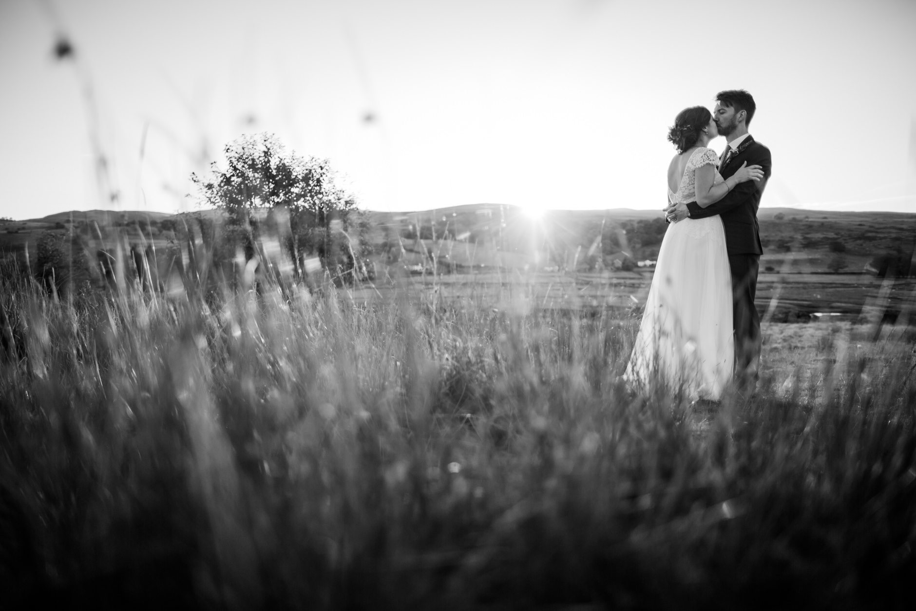 black and white portrait of bride and groom kissing at knipe hall