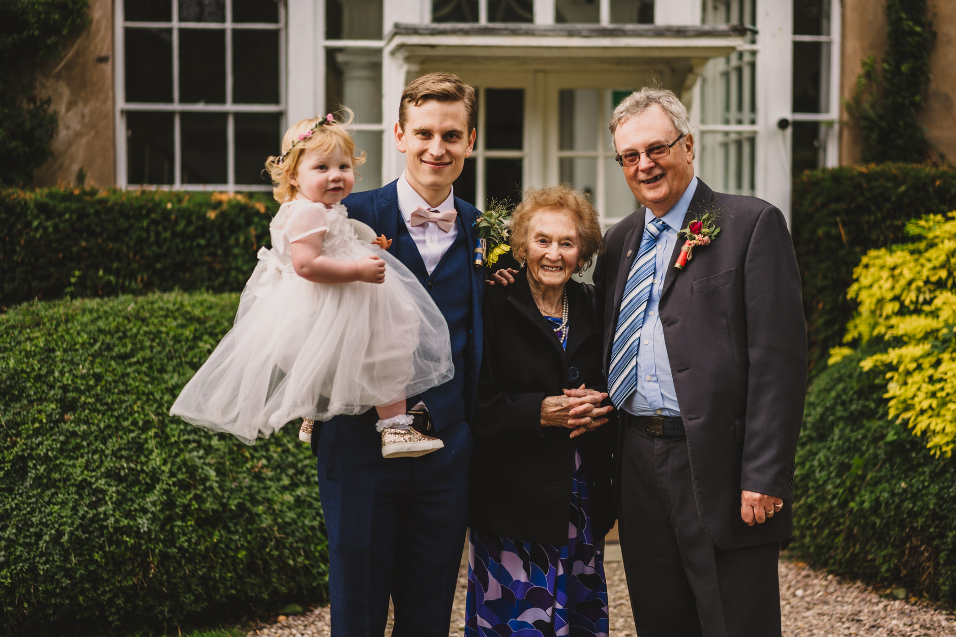 groom with his daughter, father and grandma at east bridgford hill wedding