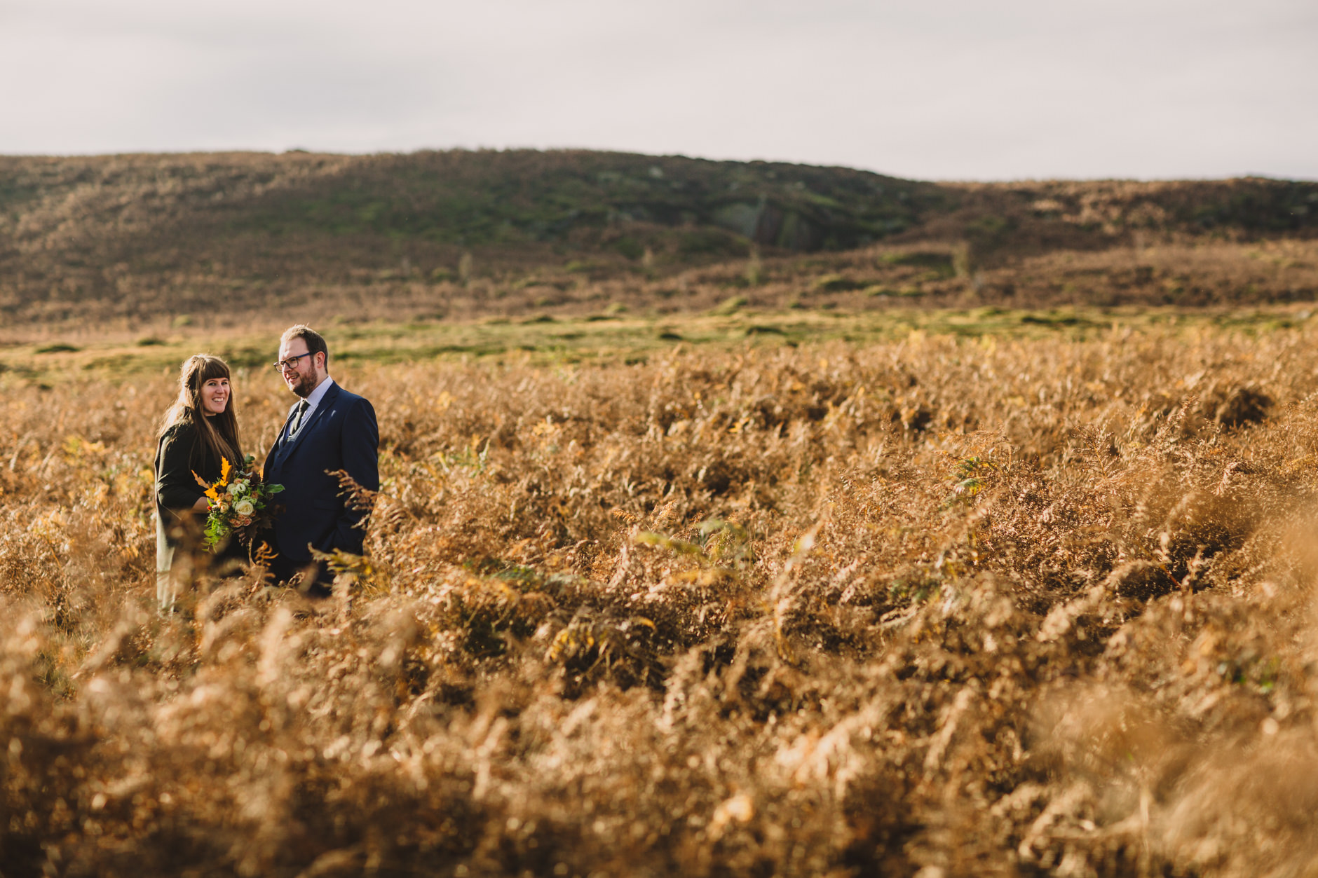 couple portrait surrounded by autumnal colours on ilkley moor