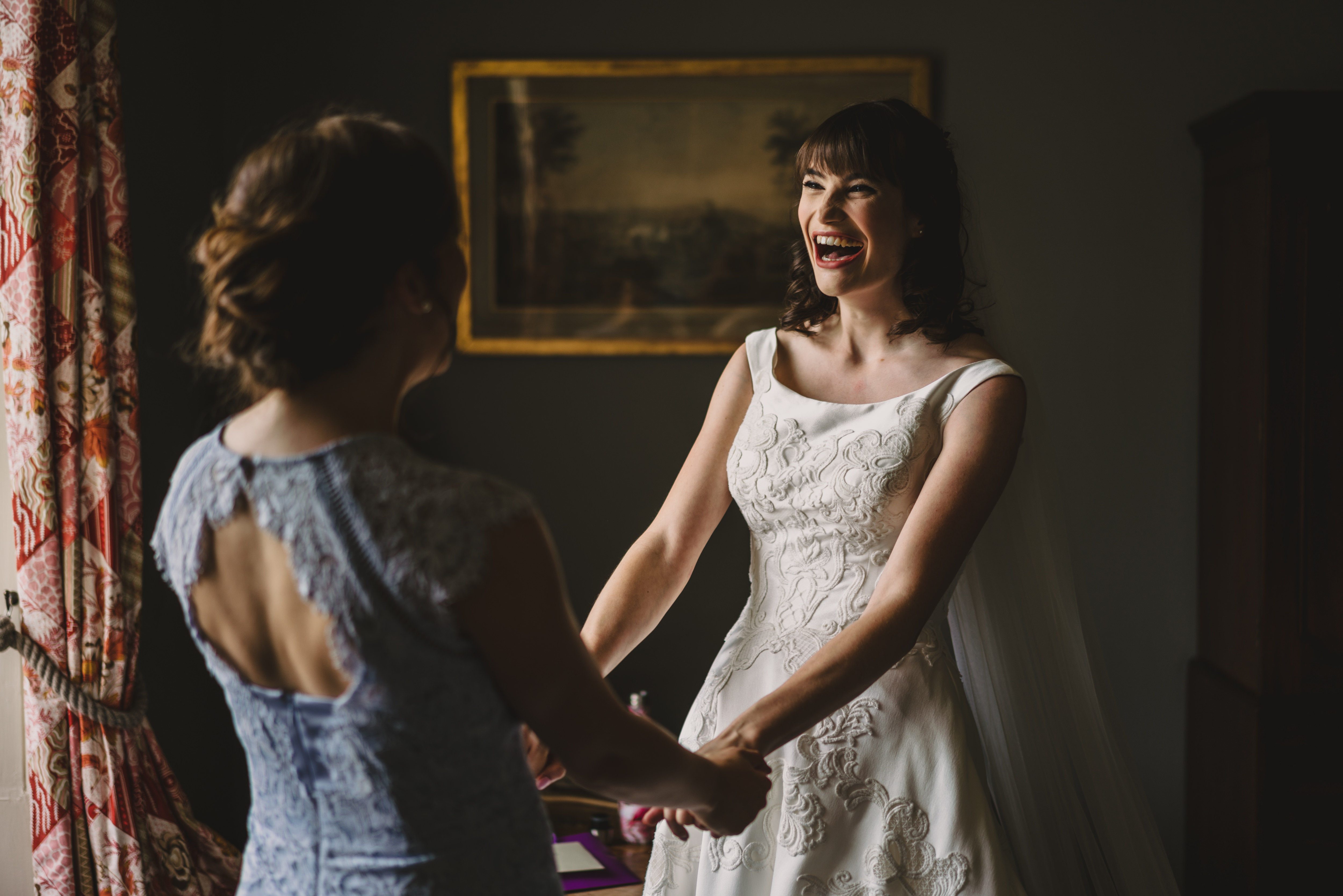 bride and her maid of honour getting ready at askham hall