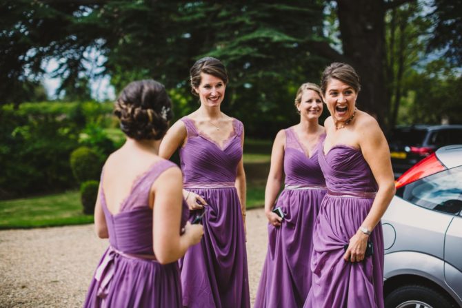 Four bridesmaids dressed in purple