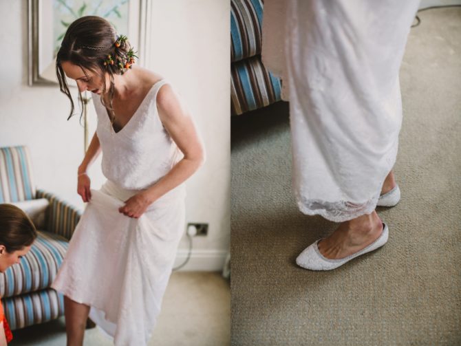 Bride putting on wedding shoes Hiking-wedding-Knipe-Hall-Cumbria